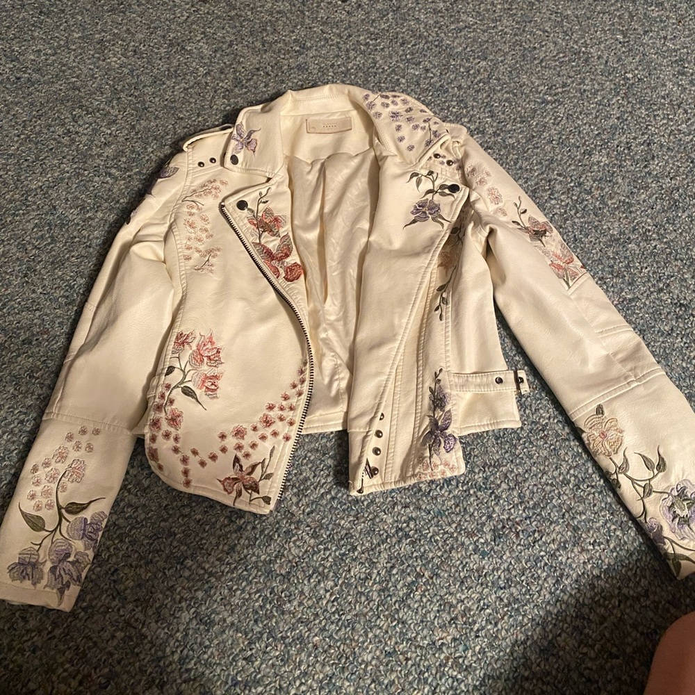White pleather jacket with flowers and studs